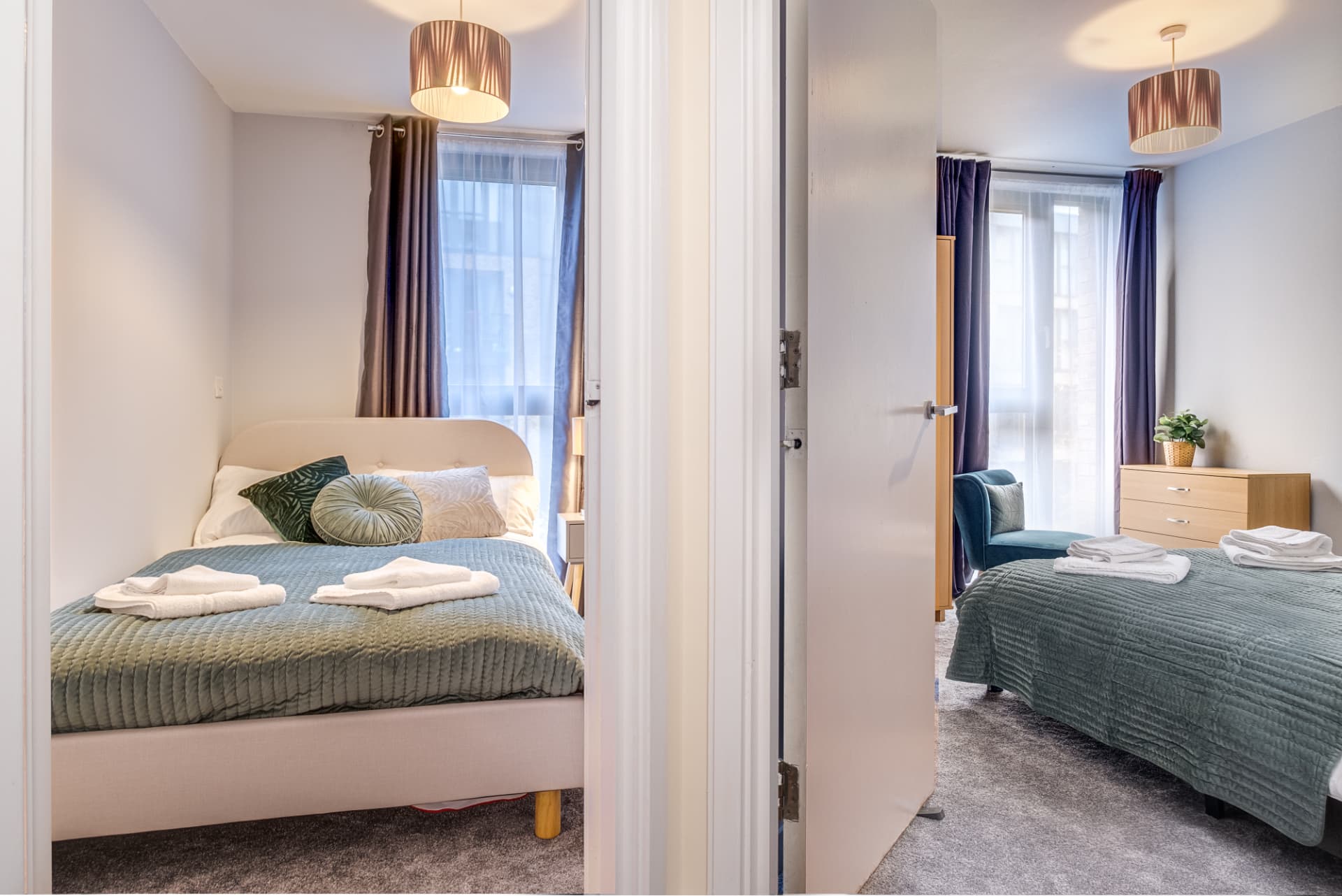 Two dressed bedrooms with sage green quilted throws and fresh towels