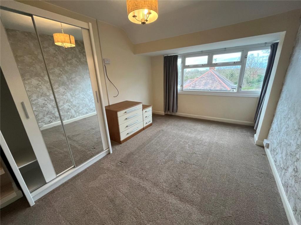 Completed double bedroom with fitted mirrored wardrobes and new carpet