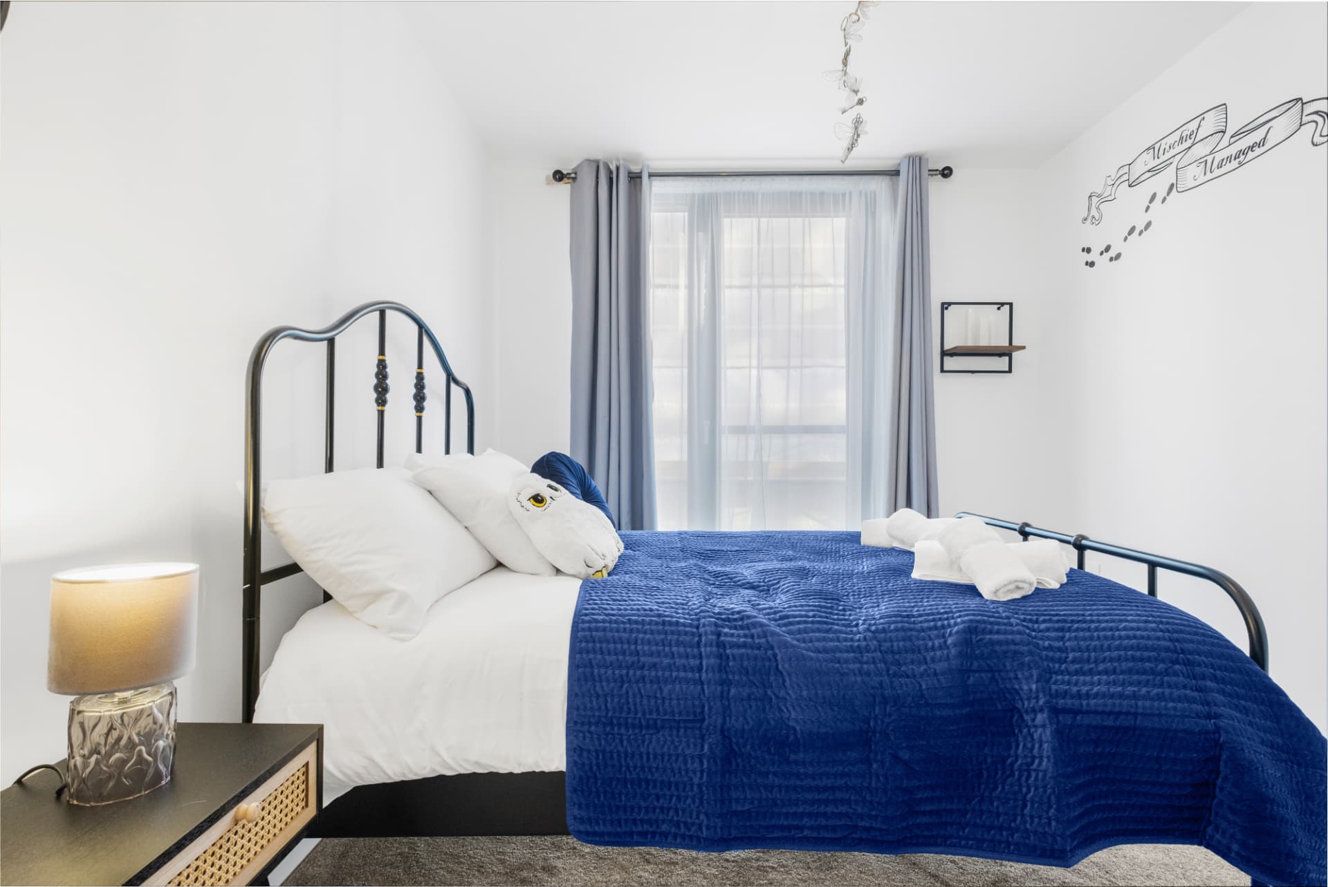 Double bedroom finished with hotel-standard linen and styling