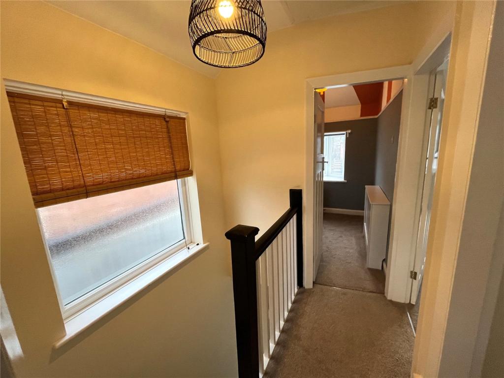 Completed first floor landing with new balustrade, carpet and pendant light