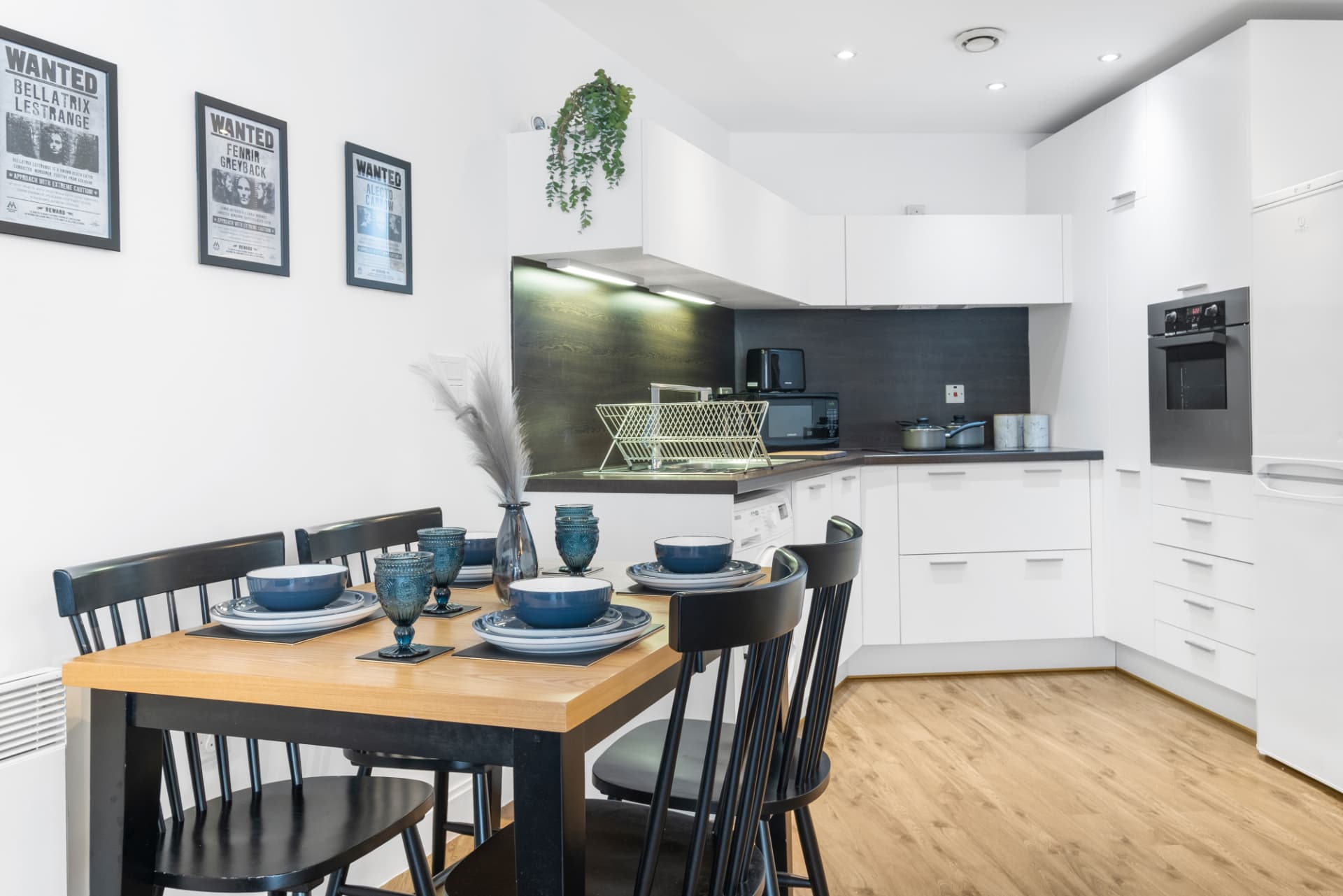 Fully equipped kitchen with dining table set for guests
